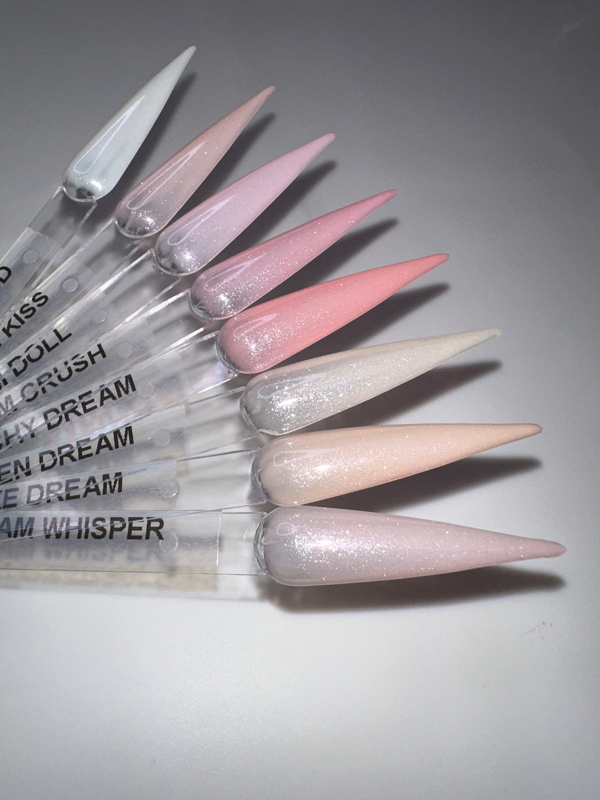 Dream Flexxi Base nude and shimmer gel shades on nail swatches
